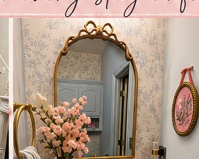 Styled powder room with gold accents